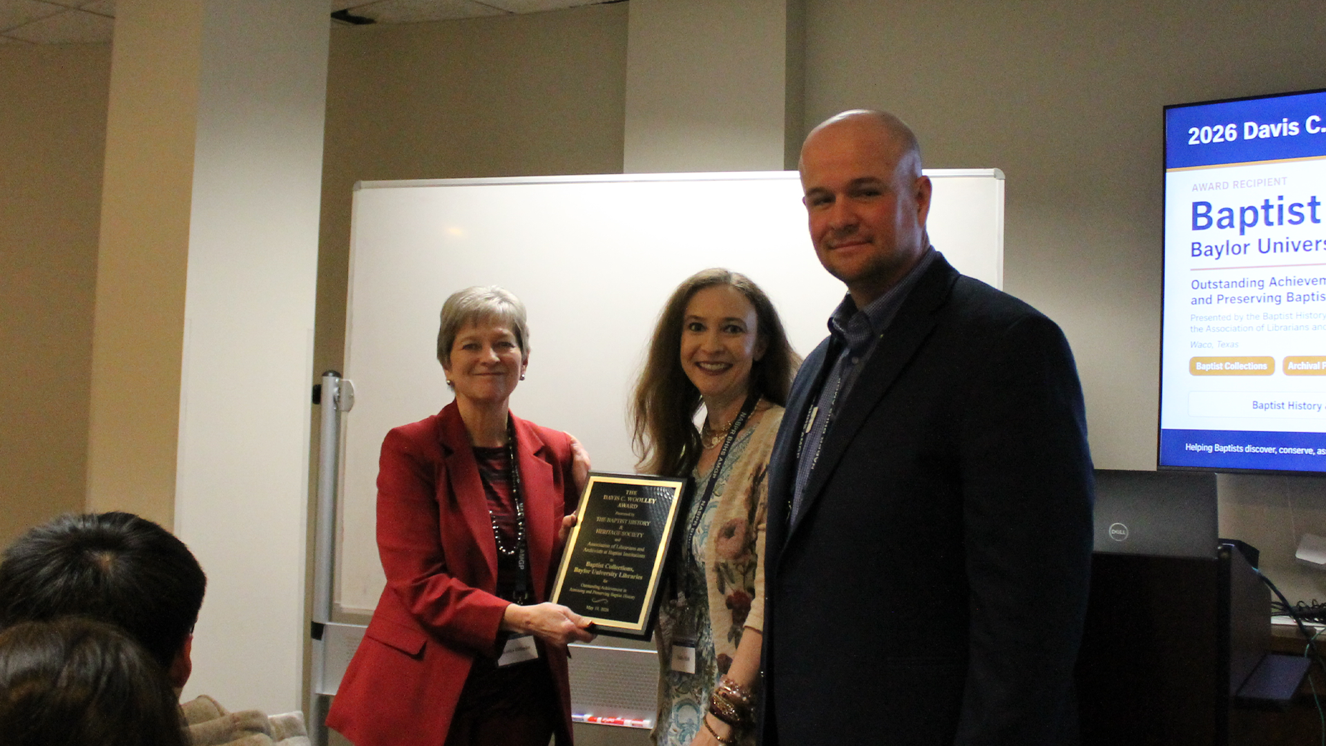 Kathy Hillman receives the Woolley Award on behalf of the Baptist Collections of the Baylor University Libraries
